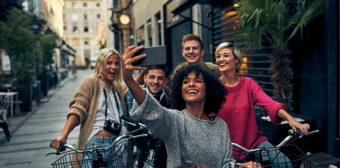 Friends taking a photo together during bike ride