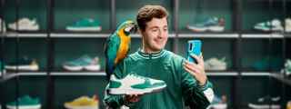 Bob holding a show with a parrot on his shoulder