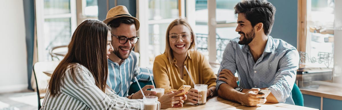 Friends talking at a cafe