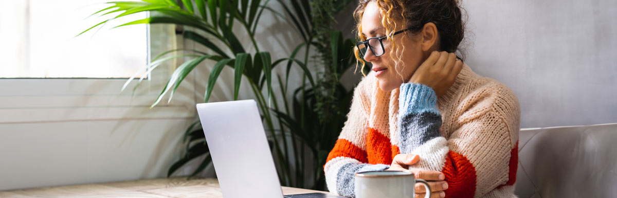 Woman with laptop and coffee