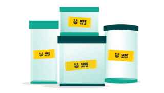 Stack of food storage containers labelled using the Oz Harvest &#39;use it up&#39; tape