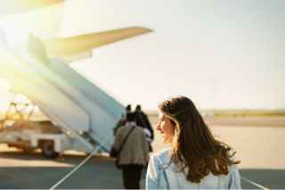 women boarding airplane