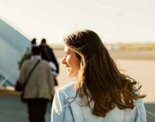 Girl on the way to board plane