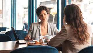 Women having a cafe meeting