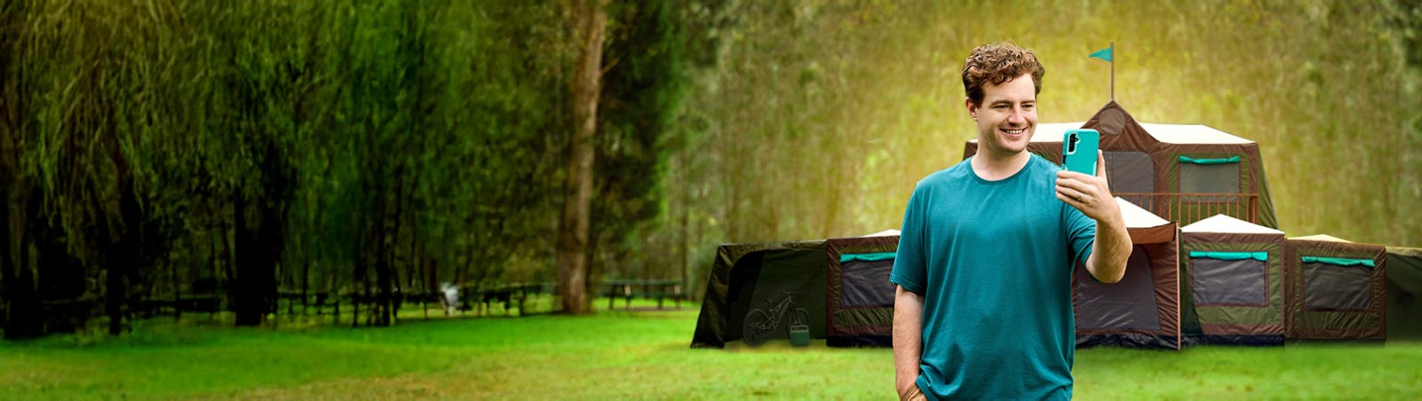 Suncorp Bank Transaction Accounts with no monthly account keeping fees and more – person standing in front of a tent looking at the Suncorp Bank App on their phone