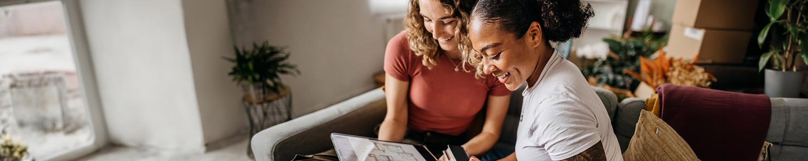 Two women looking at interior designs