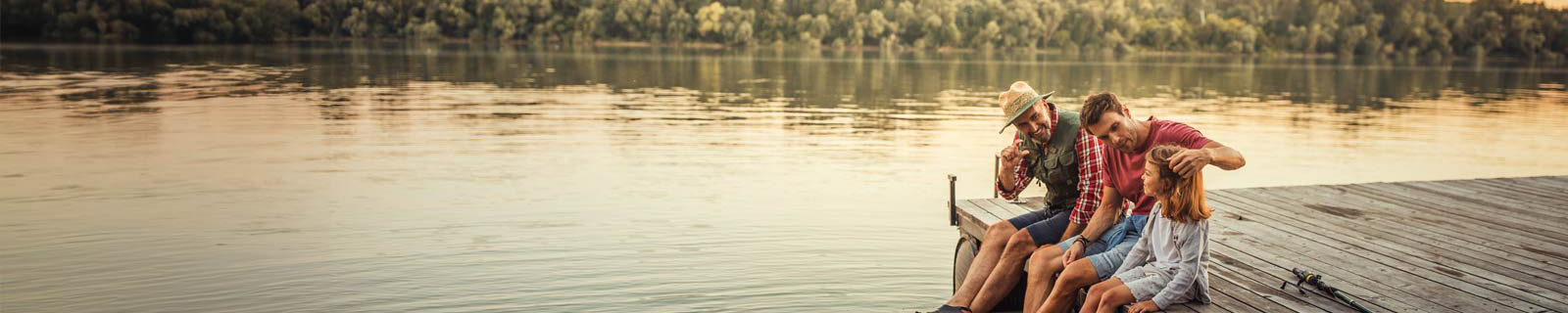 Group sitting on a dock overlooking a lake