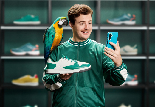 Bob holding a show with a parrot on his shoulder
