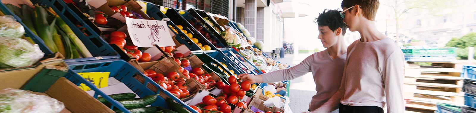 Two woman shopping at fruit store