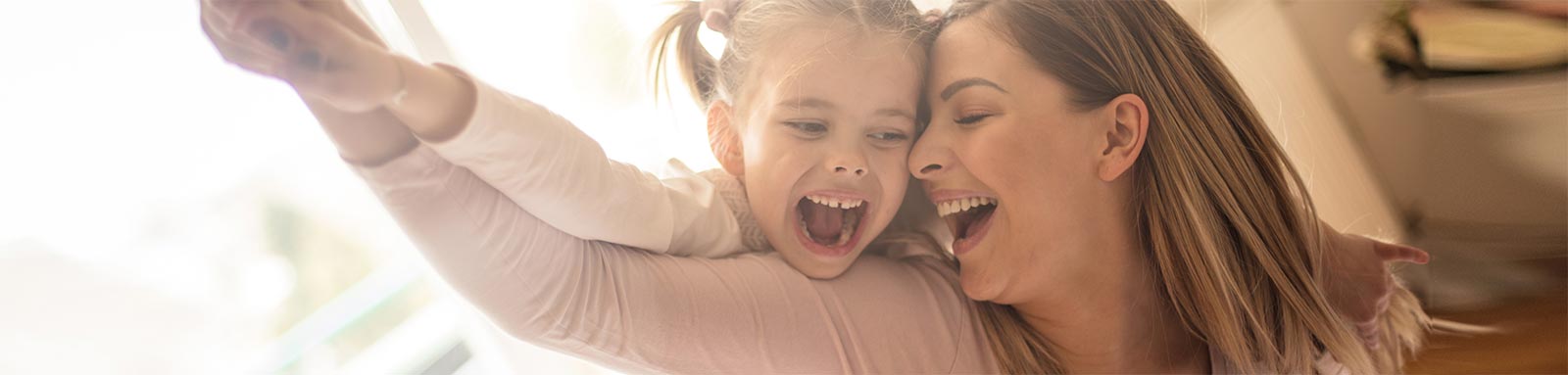 A mother & her girl are having fun together.