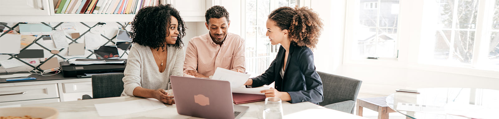 Couple talking to an advisor at home