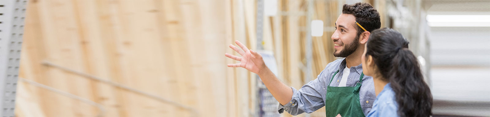 Hardware store assistant talking to customer