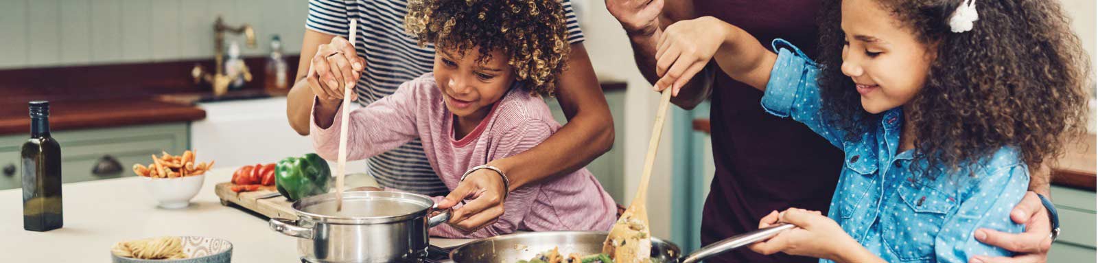 Family in the kitchen cooking a meal