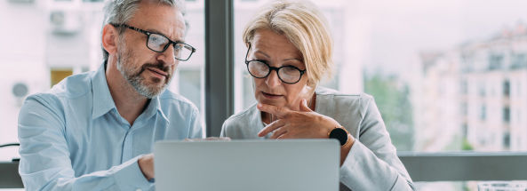 Couple looking at laptop