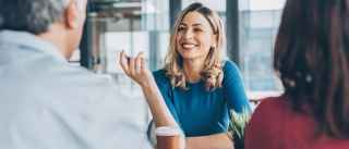happy woman smiling at meeting