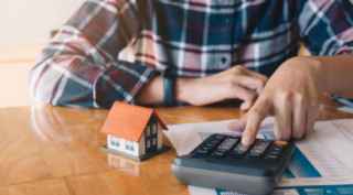 Person using an analogue calculator