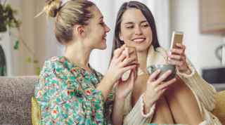 Two women looking at their phones