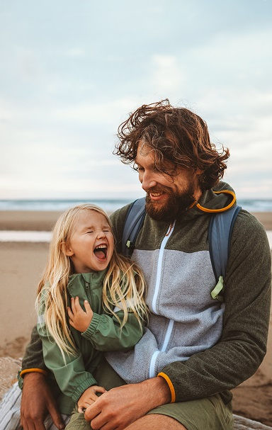 Father and daughter enjoying time at the beach