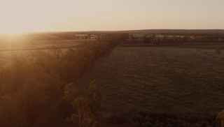 Trebbins sunrise over land