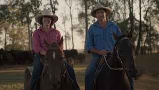 Trebbins man and woman on horses