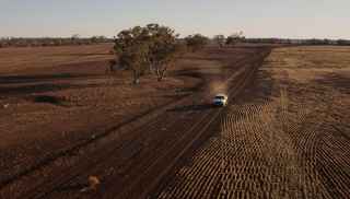 Trebbins car driving through dirt road